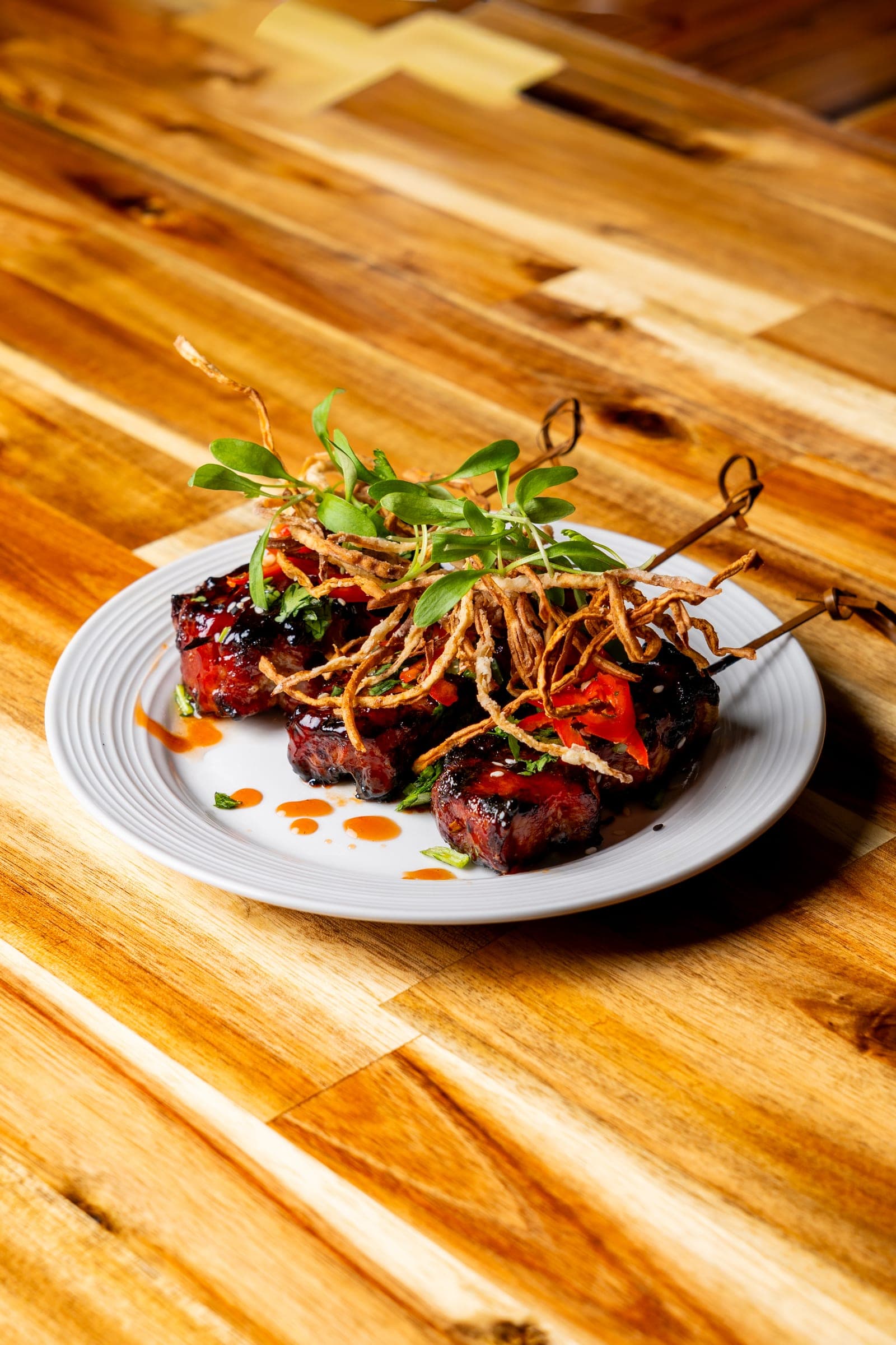 Glazed short rib over a crispy noodle nest