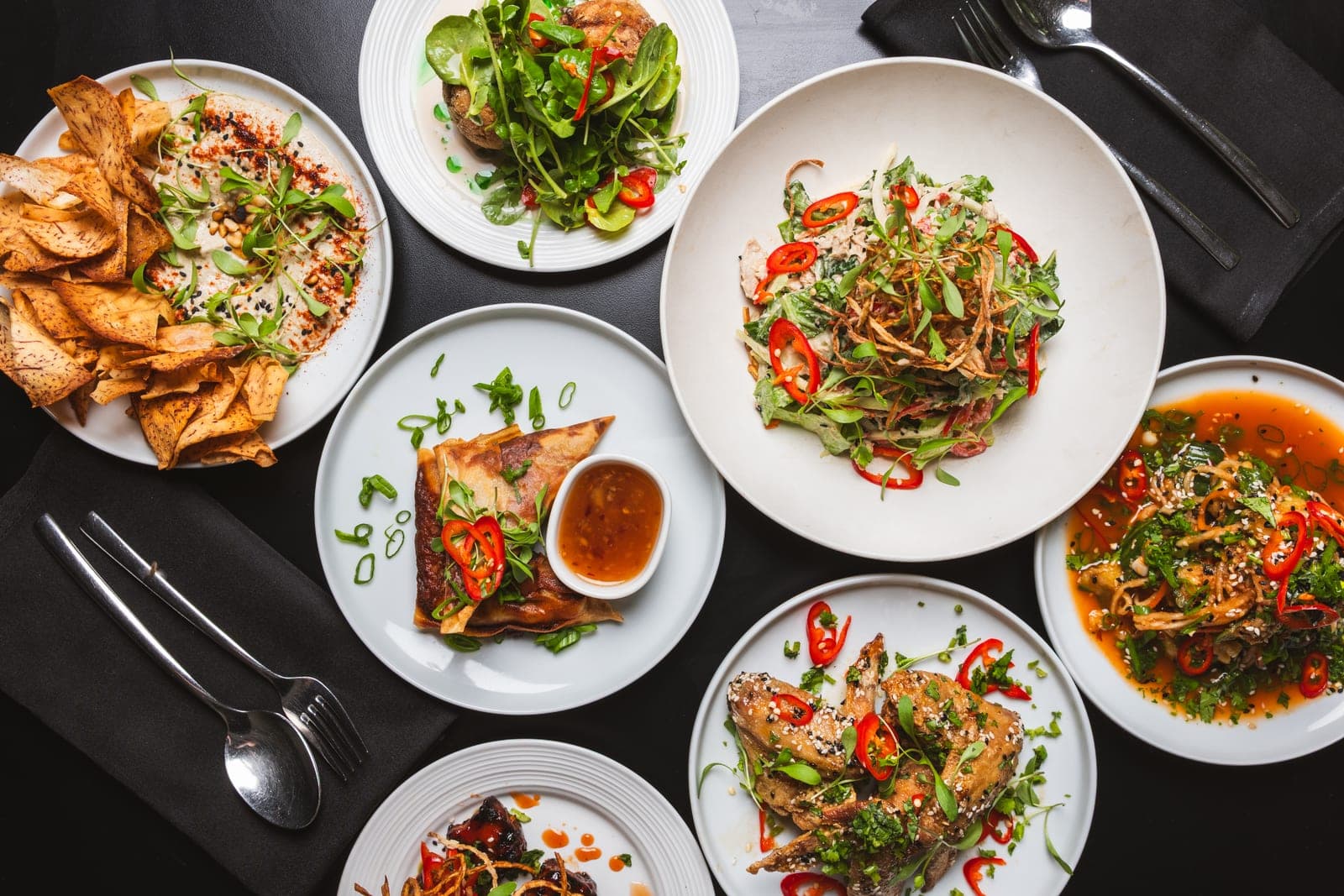 A spread of shared small plates across the table