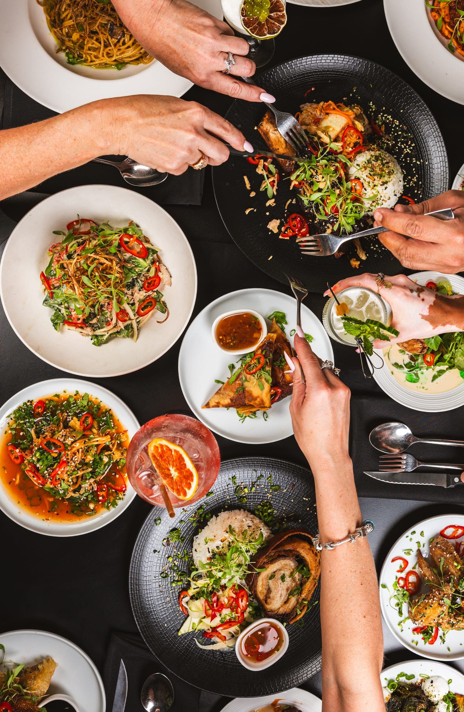 Overhead spread of plates and dipping sauces